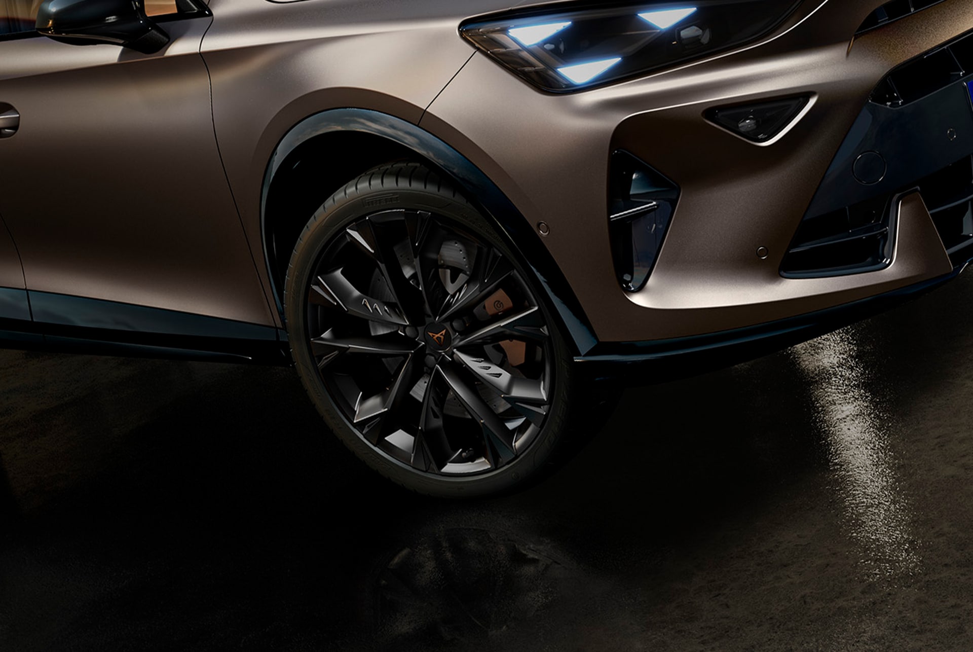 cupra-formentor-close-up-of-alloy-wheel-and-part-of-bumper-parked-in-an-dark-environment