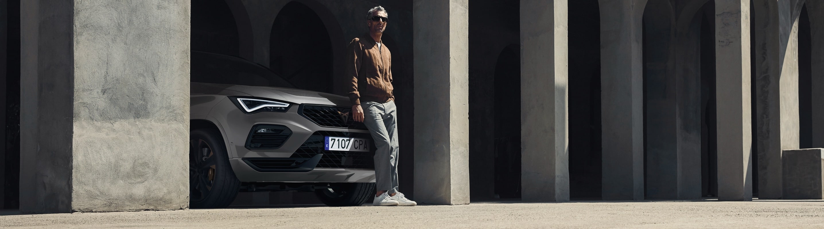 Man leaning on CUPRA Formentor front grill